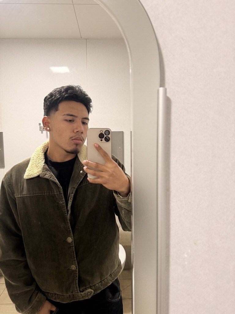 Gabriel Torres — mirror selfie in a corduroy sherpa jacket